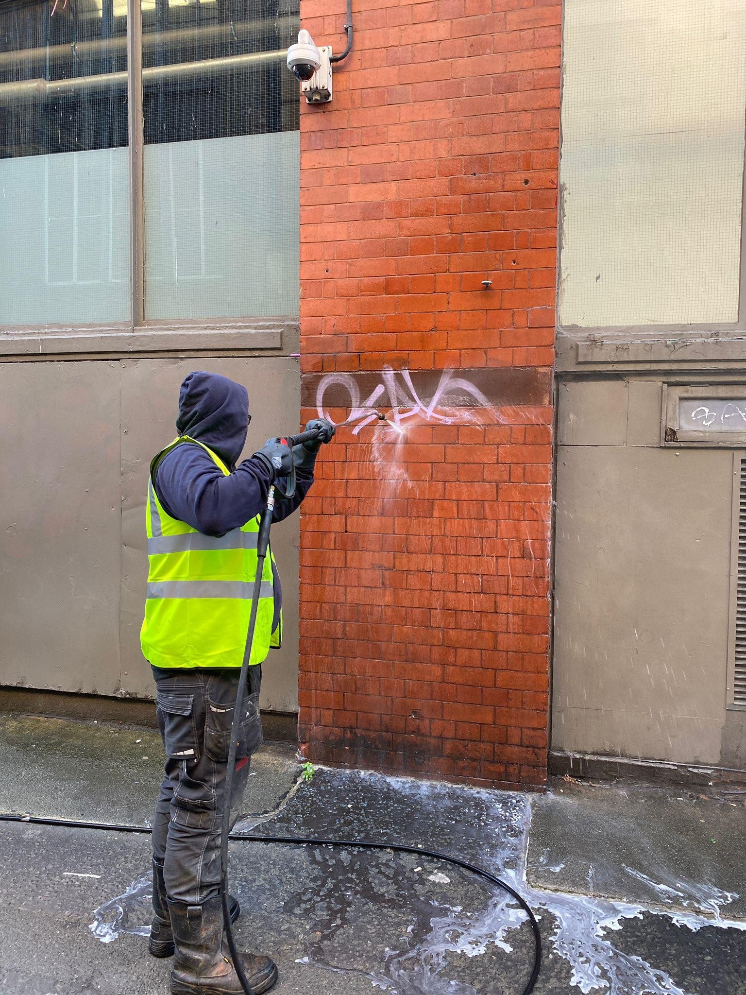 Paint and stain removal from building surface